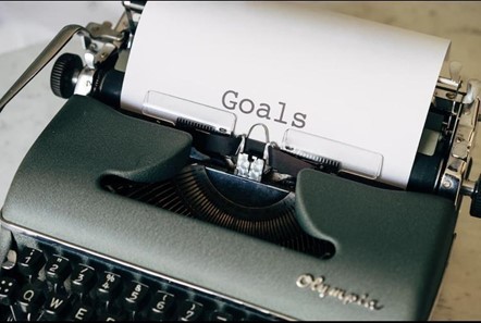 typing machine with goals text